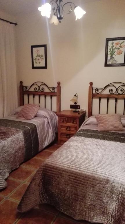 Postel nebo postele na pokoji v ubytování Cortijo Rural Los Gonzalez