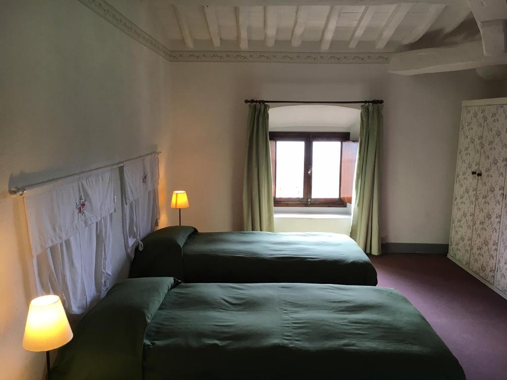 Postel nebo postele na pokoji v ubytování Al Palazzaccio
