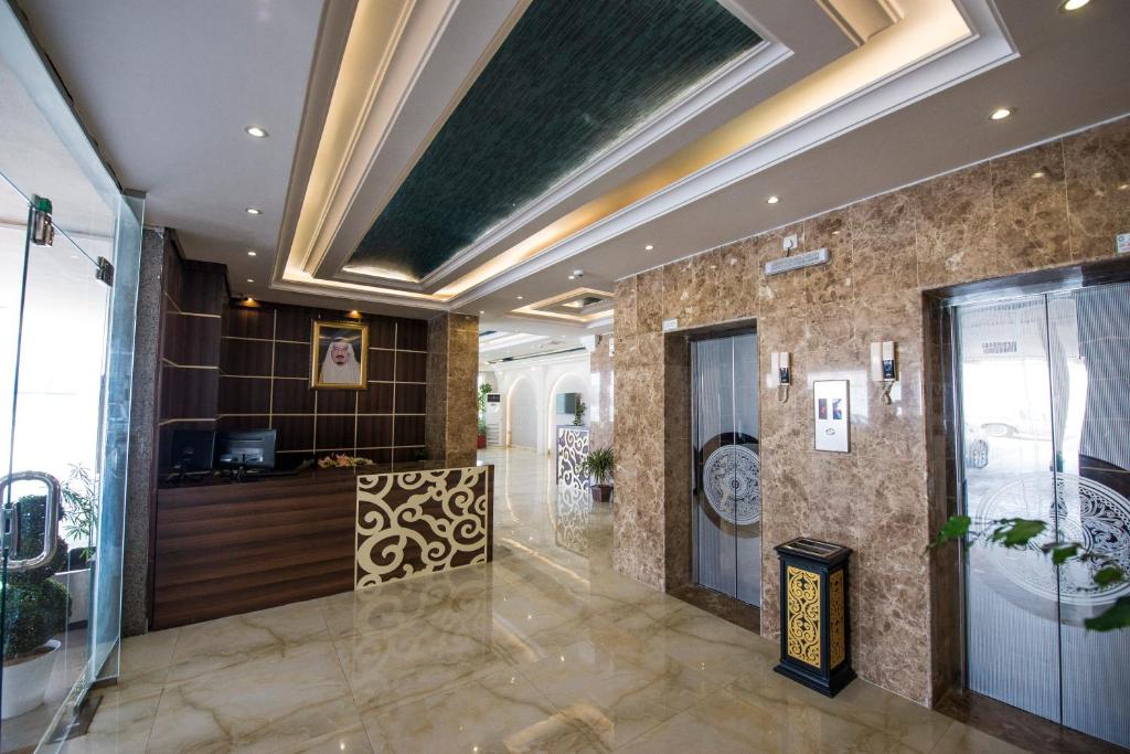 a lobby of a building with a ceiling at Al Nakhla Aparthotel in Al Hofuf