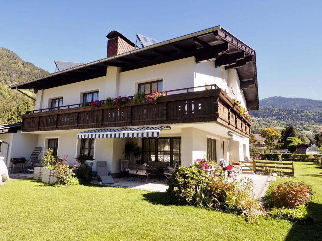 a large house with a balcony on top of it at Haus Vollmeier in Debant