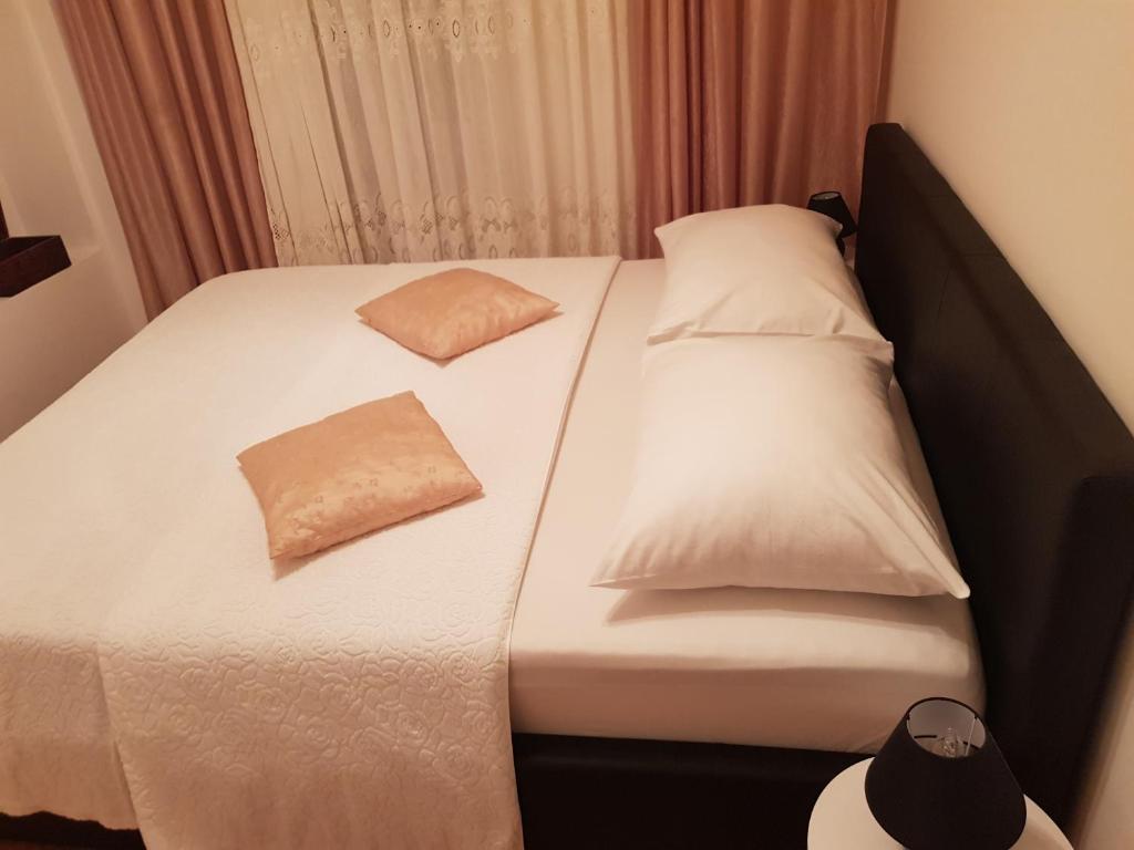 Postel nebo postele na pokoji v ubytování Apartments Minerva