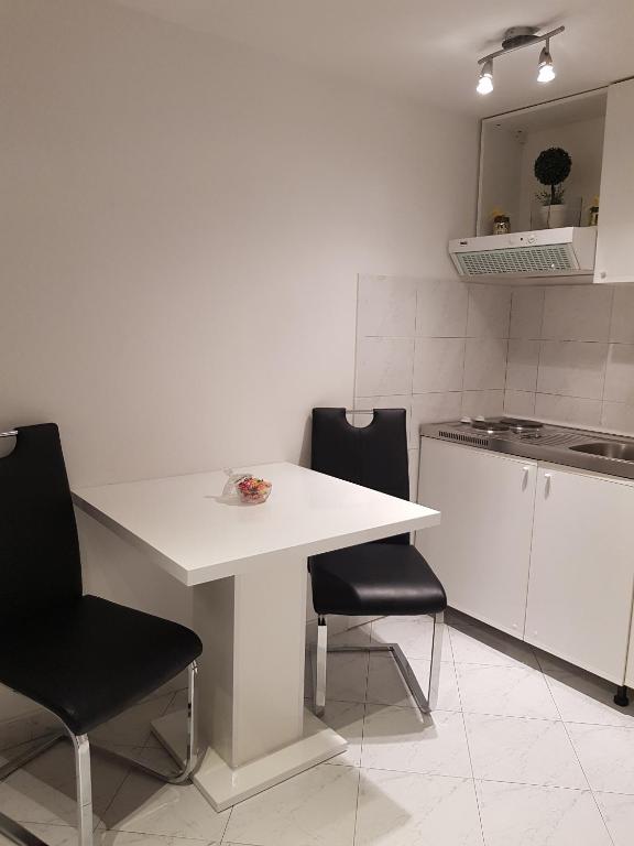 Kuchyň nebo kuchyňský kout v ubytování Apartments Minerva