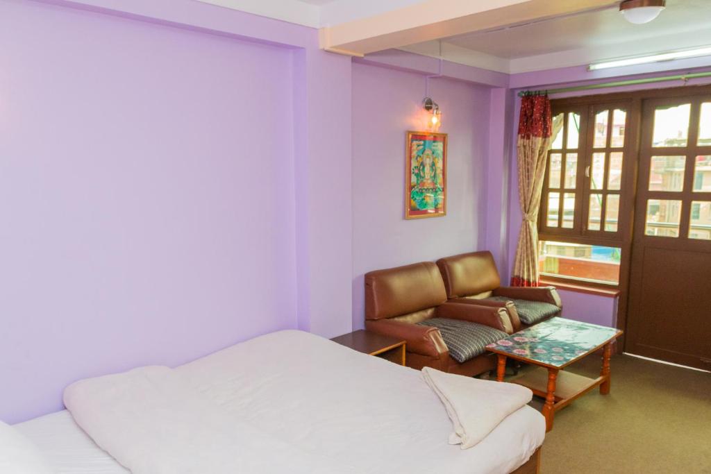 Postel nebo postele na pokoji v ubytování Swastik Guest House