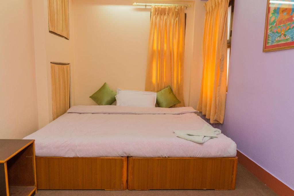 Postel nebo postele na pokoji v ubytování Swastik Guest House