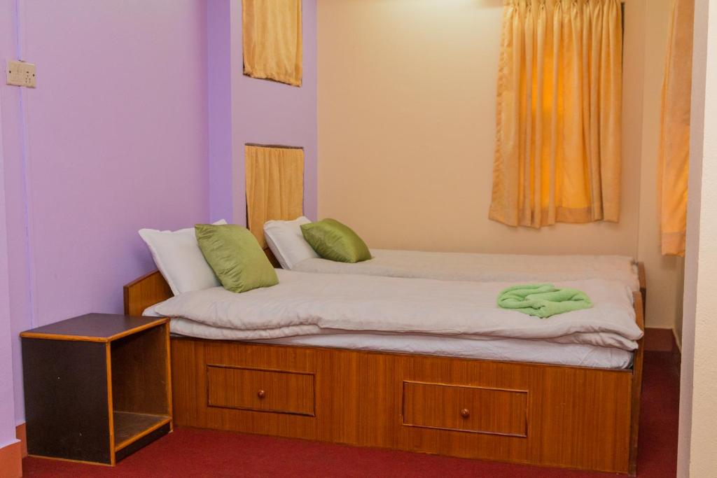 Postel nebo postele na pokoji v ubytování Swastik Guest House
