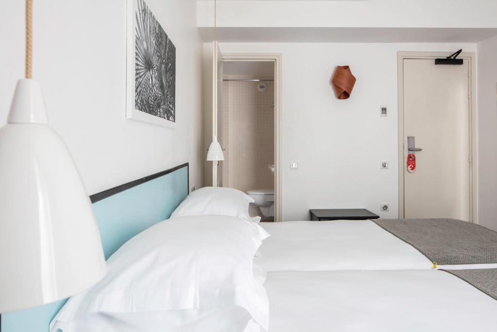 Ліжко або ліжка в номері Hotel Palm - Astotel