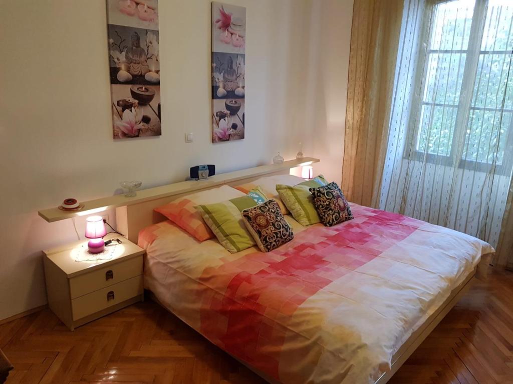 Łóżko lub łóżka w pokoju w obiekcie Noemi City Apartments