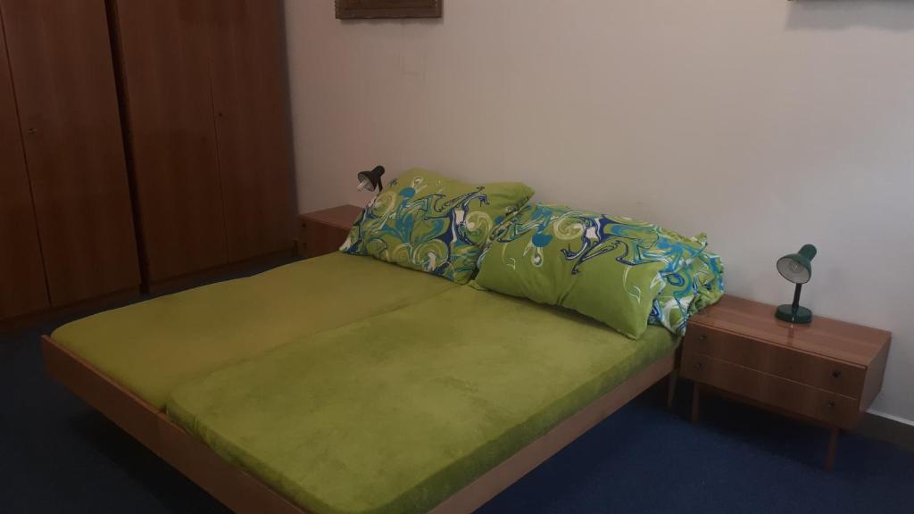 Postel nebo postele na pokoji v ubytování Apartmány KOS