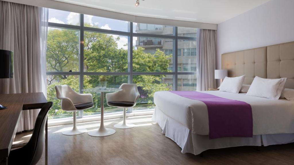 Postel nebo postele na pokoji v ubytování Vivaldi Hotel Loft Punta Carretas