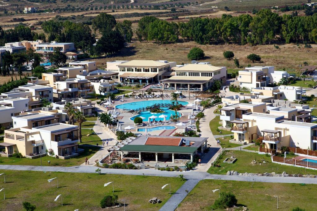 an aerial view of a resort with a swimming pool at Natura Park Village Hotel & Spa in Psalidi