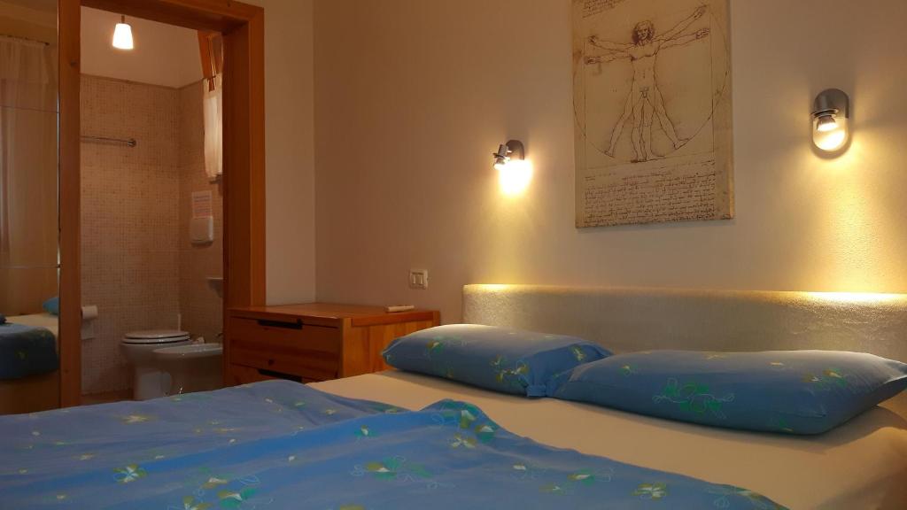 Postel nebo postele na pokoji v ubytování Villa I Tamarigi