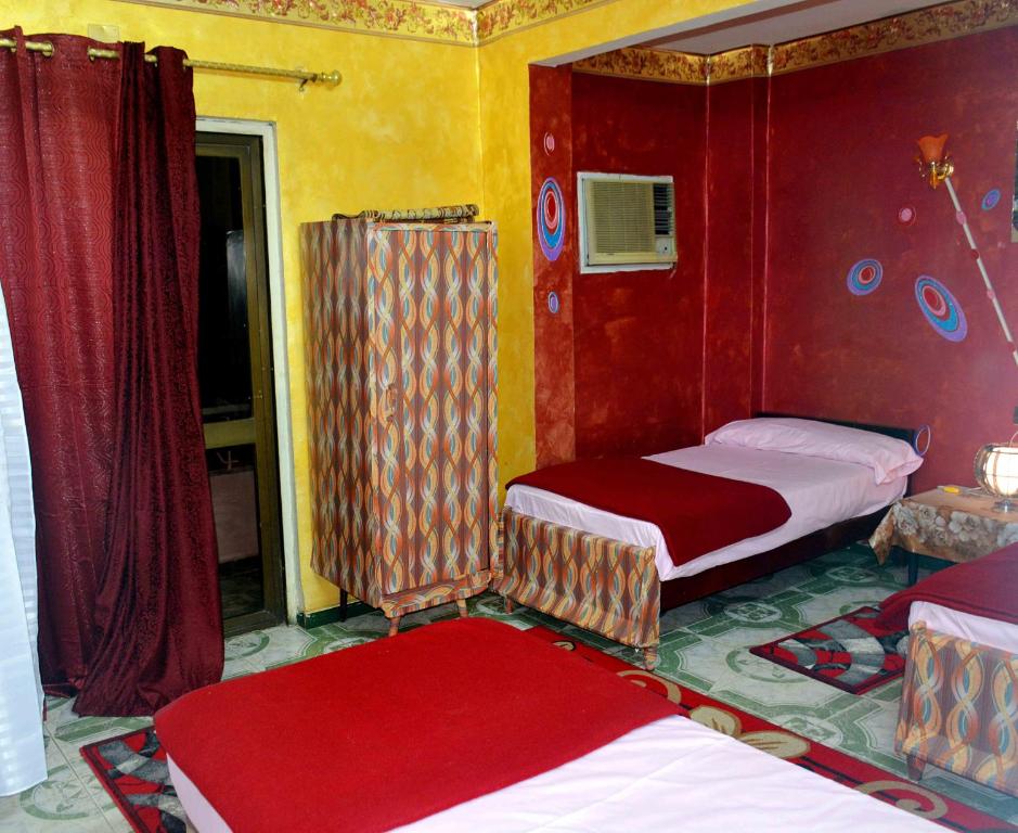 Postel nebo postele na pokoji v ubytování City Hostel