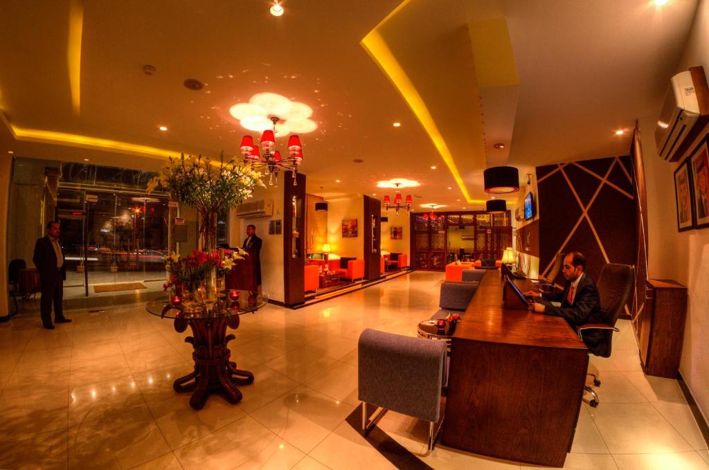 The lobby or reception area at Meneur Hotel