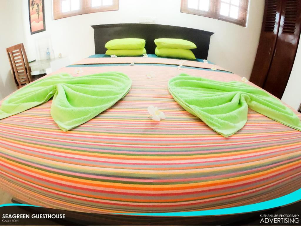 Postel nebo postele na pokoji v ubytování Seagreen Guesthouse - Galle Fort