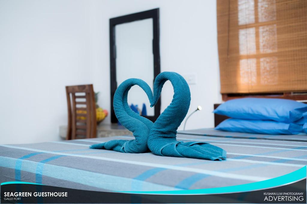 Postel nebo postele na pokoji v ubytování Seagreen Guesthouse - Galle Fort
