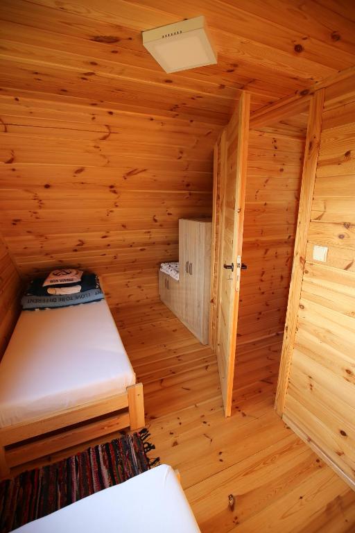 Postel nebo postele na pokoji v ubytování Domek letniskowy Orzechowa