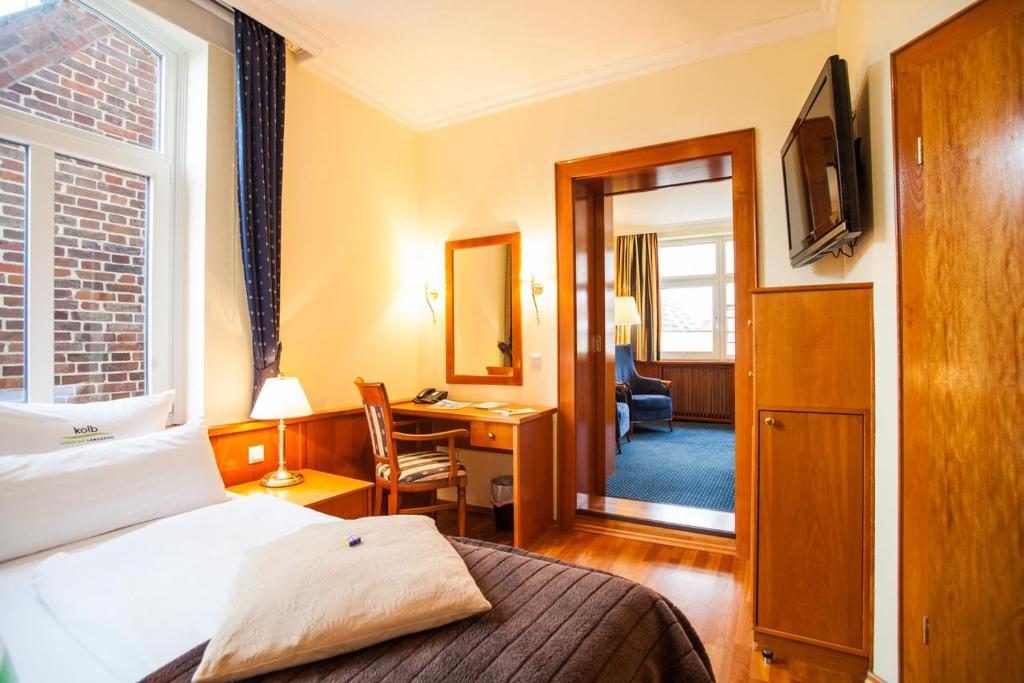 Voodi või voodid majutusasutuse HOTEL DÜNENLÄUFER Langeoog toas