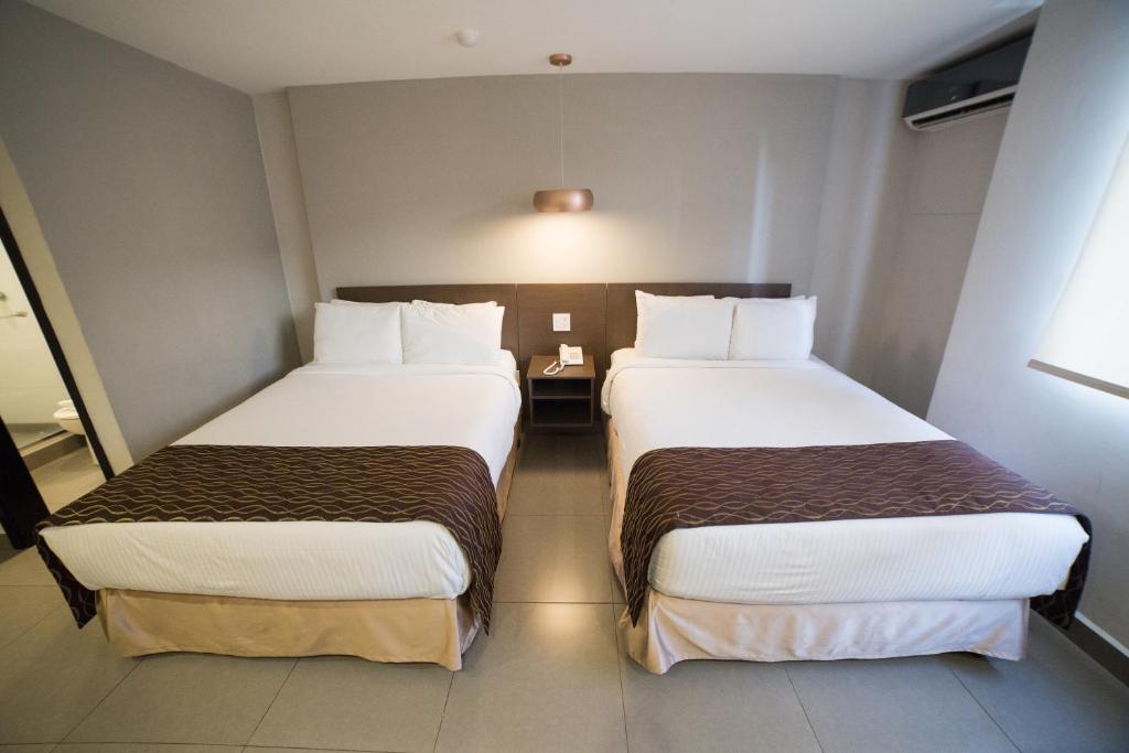 Postel nebo postele na pokoji v ubytování Hotel Ojos Del Rio