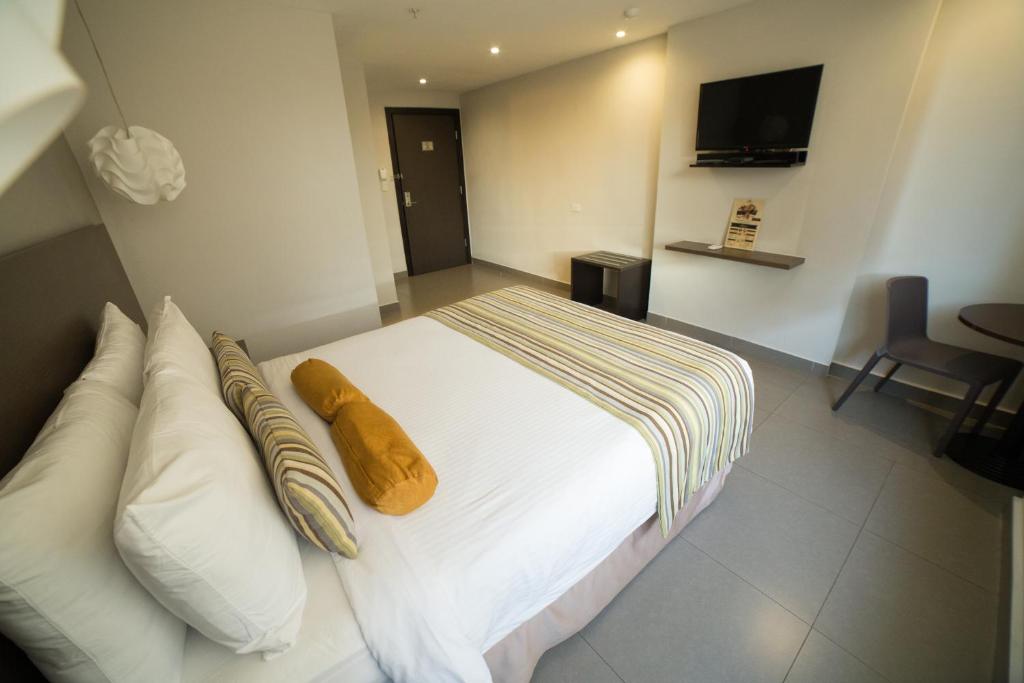 Postel nebo postele na pokoji v ubytování Hotel Ojos Del Rio