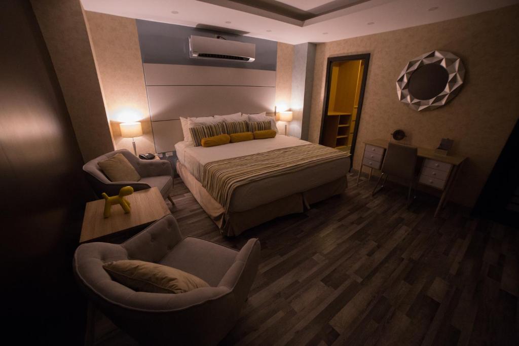 Postel nebo postele na pokoji v ubytování Hotel Ojos Del Rio