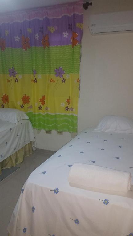 Postel nebo postele na pokoji v ubytování Hostel Quintonido