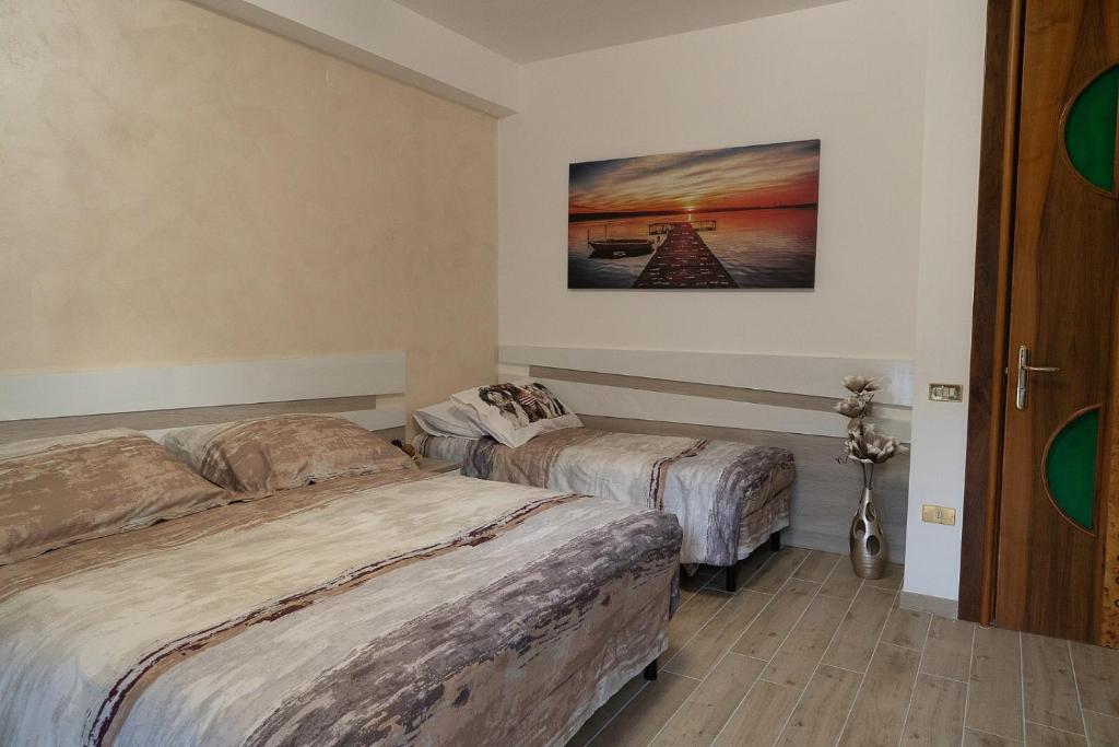 Posteľ alebo postele v izbe v ubytovaní B&B IL CAVALIERE