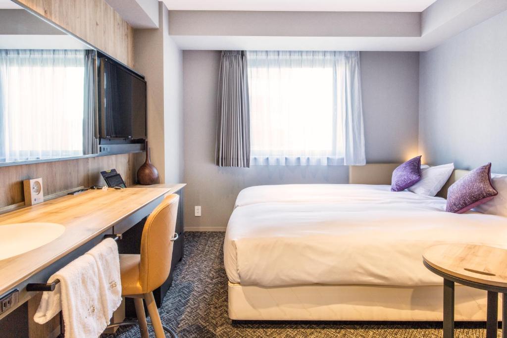 Cama ou camas em um quarto em Hotel Musse Ginza Meitetsu