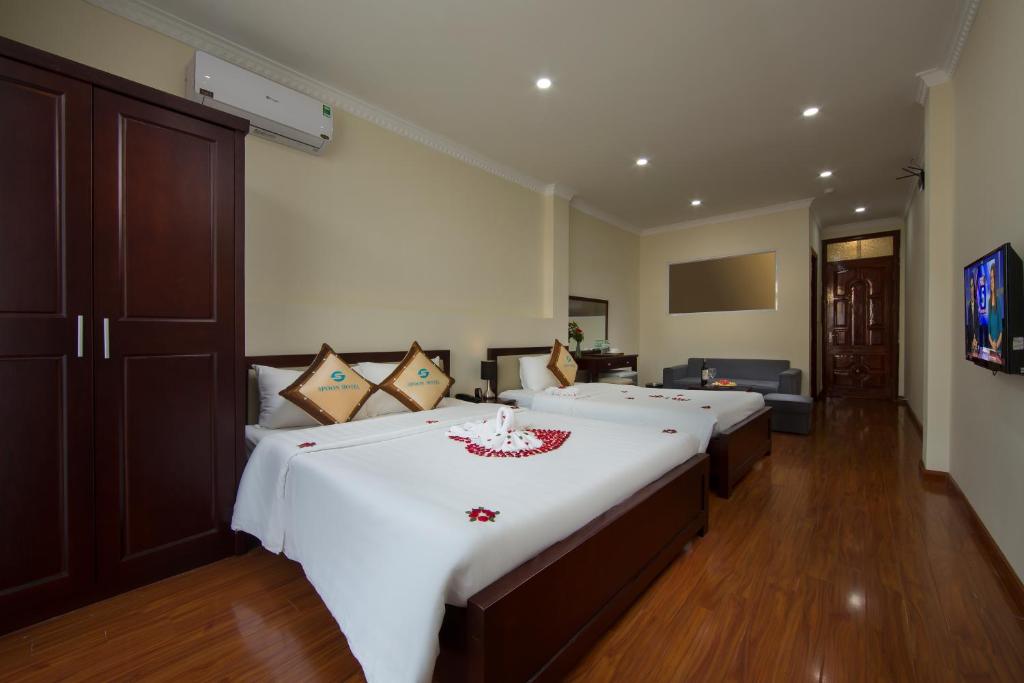 Postel nebo postele na pokoji v ubytování Spoon Hotel