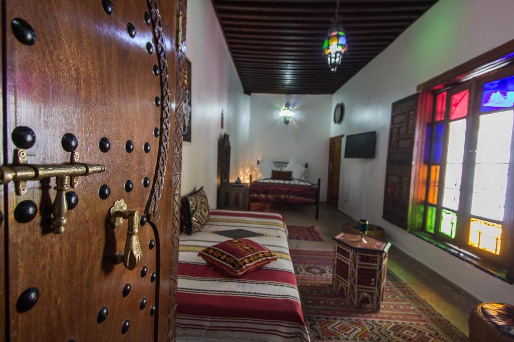 Un ou plusieurs lits dans un hébergement de l'établissement Riad Sanaa Rose