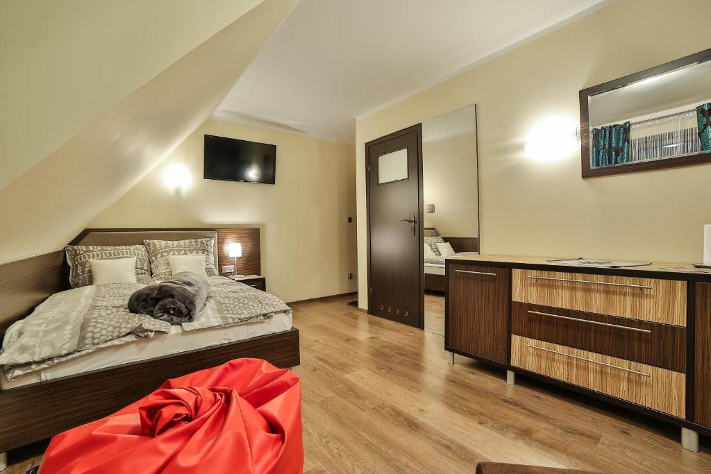 Posteľ alebo postele v izbe v ubytovaní Apartamenty Kościelisko