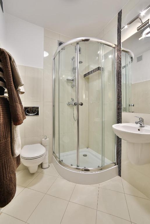 Kúpeľňa v ubytovaní Apartamenty Kościelisko