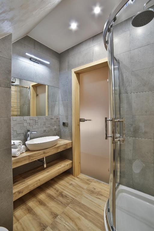 Kúpeľňa v ubytovaní Apartamenty Kościelisko
