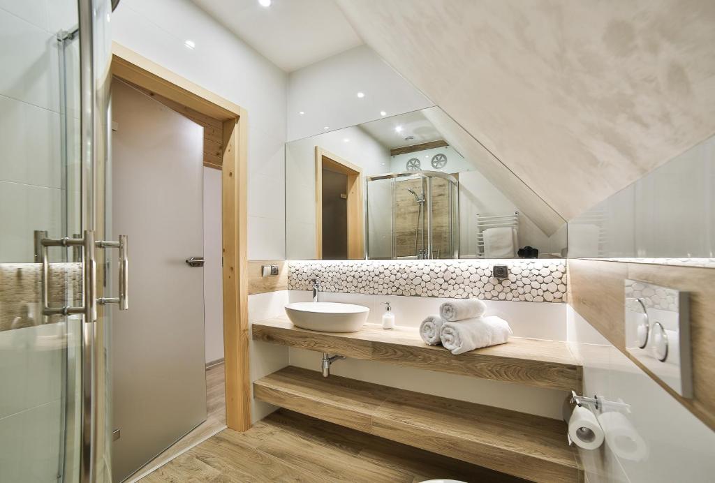 Kúpeľňa v ubytovaní Apartamenty Kościelisko