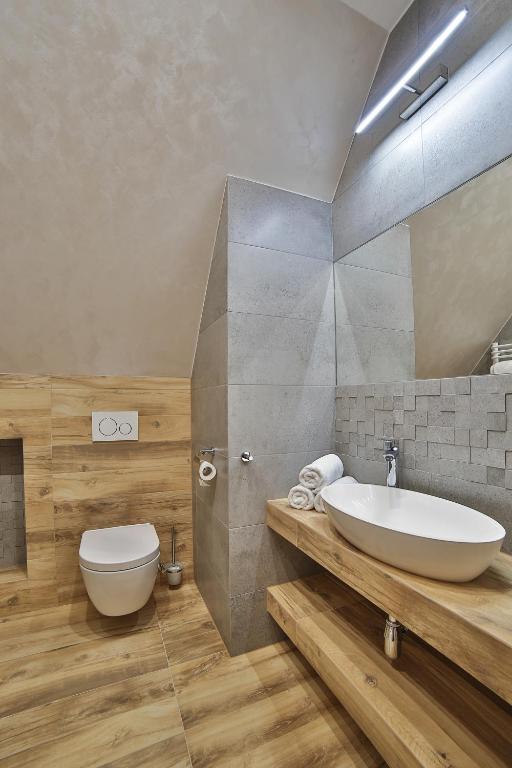 Kúpeľňa v ubytovaní Apartamenty Kościelisko