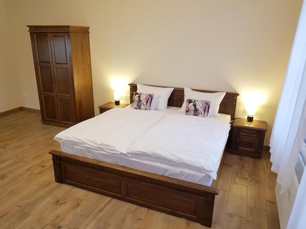 Posteľ alebo postele v izbe v ubytovaní Toscana Apartman