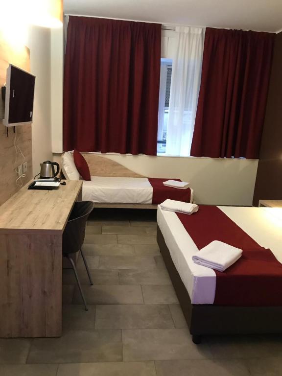 Postel nebo postele na pokoji v ubytování Hotel Stradivari