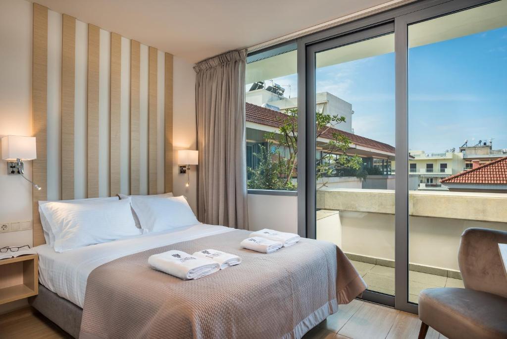 
Un ou plusieurs lits dans un hébergement de l'établissement Trianon Luxury Apartments & Suites
