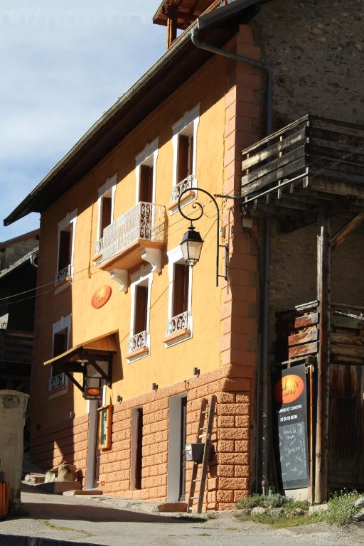 a building with a sign on the side of it at Yak Avenir in Aiguilles