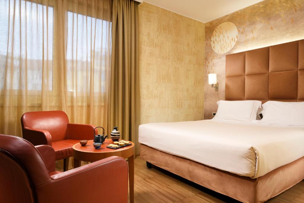 Postel nebo postele na pokoji v ubytování Enterprise Hotel Design & Boutique