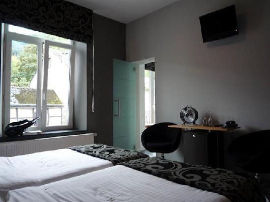 Postel nebo postele na pokoji v ubytování Hotel La Librairie