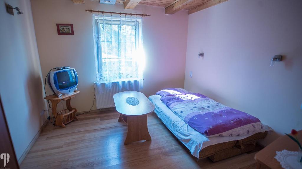Posteľ alebo postele v izbe v ubytovaní Dom nad potokiem