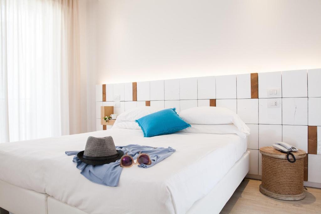 Postel nebo postele na pokoji v ubytování Hotel Solemare
