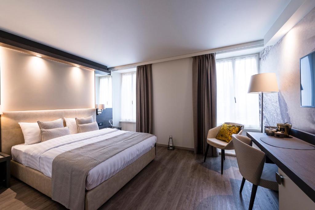 Postel nebo postele na pokoji v ubytování Ambassador Boutique Hotel