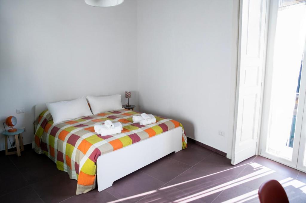 Łóżko lub łóżka w pokoju w obiekcie Casa Magà