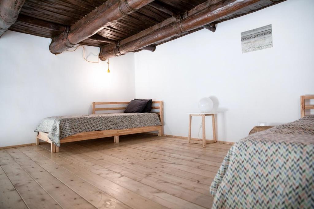 Łóżko lub łóżka w pokoju w obiekcie Casa Magà