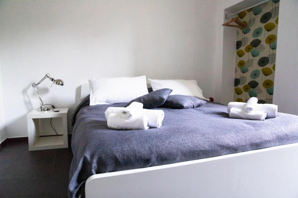 Łóżko lub łóżka w pokoju w obiekcie Casa Magà