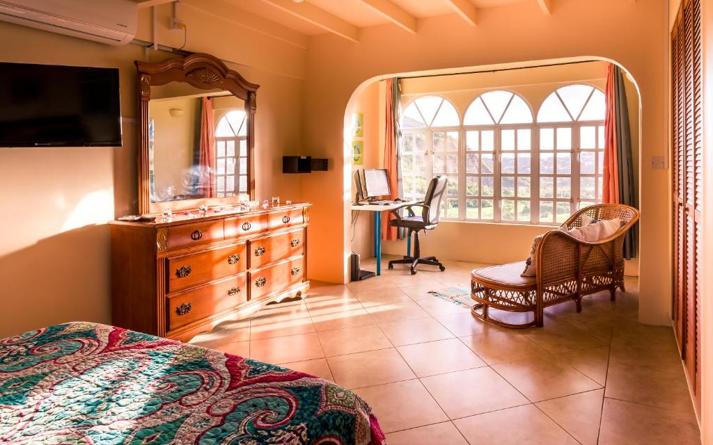 Ліжко або ліжка в номері flamboyantvilla