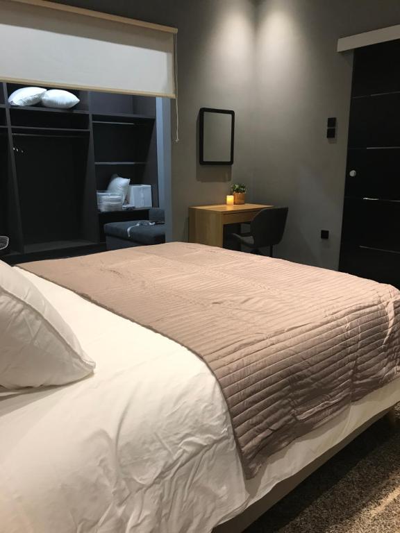 Posteľ alebo postele v izbe v ubytovaní L apartment