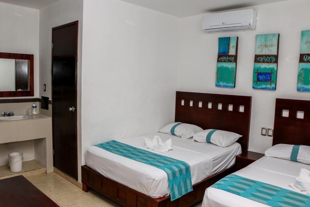 Postel nebo postele na pokoji v ubytování Playa Linda Hotel
