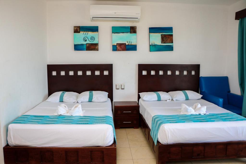 Postel nebo postele na pokoji v ubytování Playa Linda Hotel